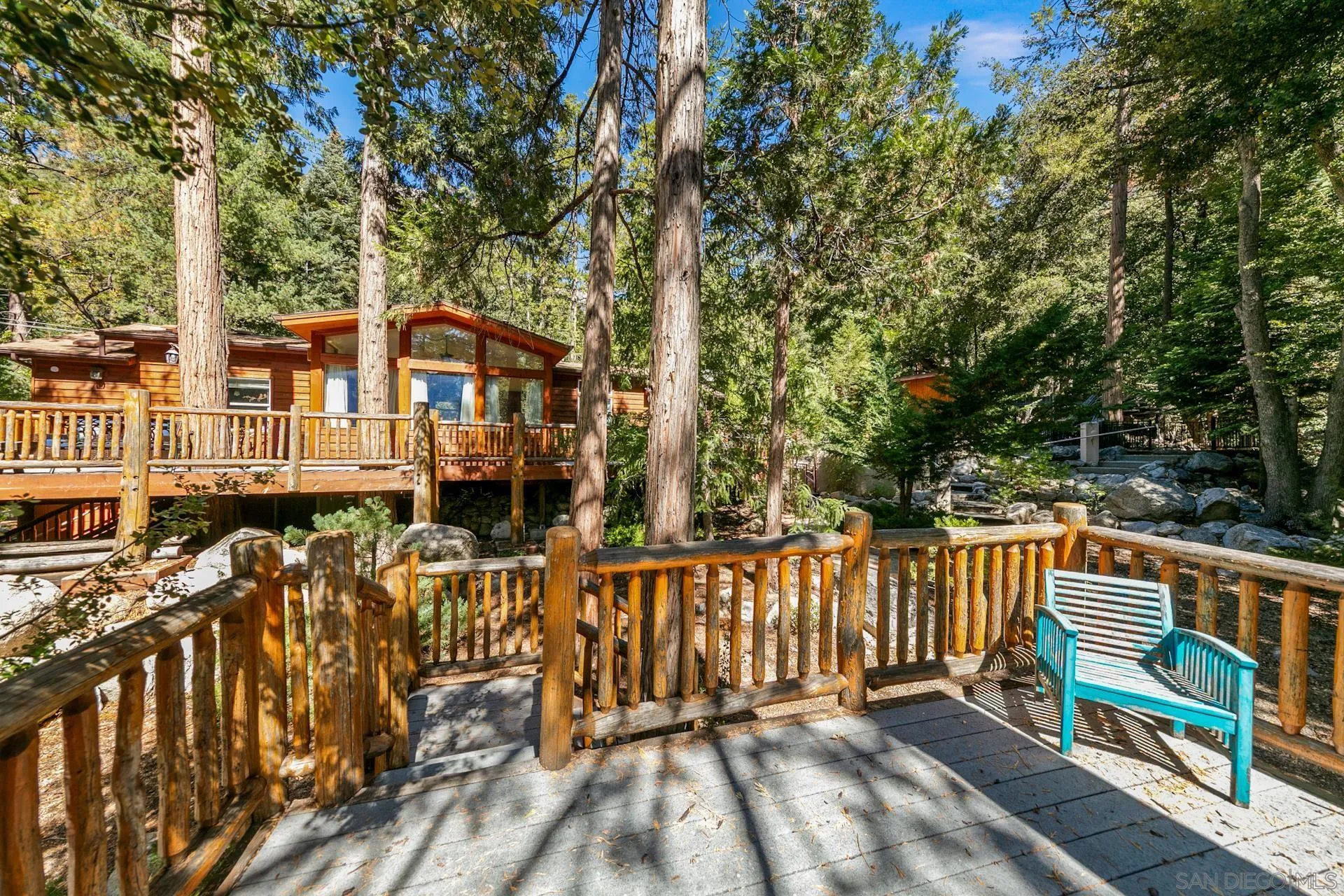24655 Upper Rim Rock Road Idyllwild, CA 92549 - Photo 5 of 48 a view of a house with wooden fence