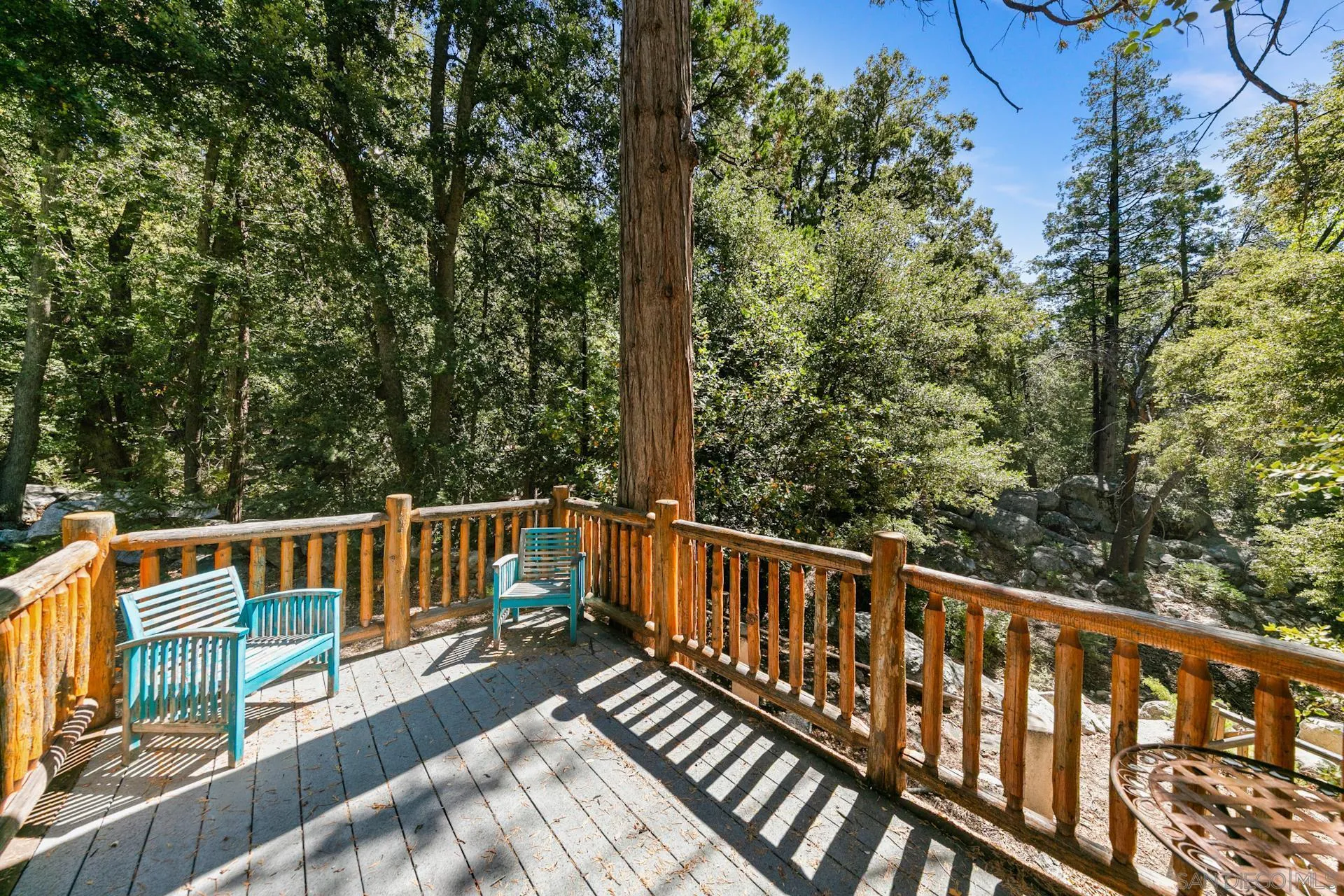 24655 Upper Rim Rock Road Idyllwild, CA 92549 - Photo 6 of 48 a view of a two chairs in the balcony