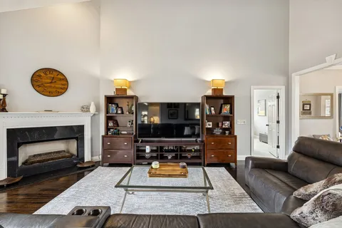a bedroom with a bed and flat screen tv