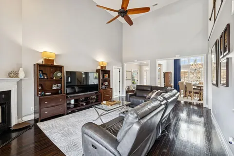 a spacious bathroom with a double vanity sink a mirror a bathtub and a window