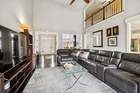 a spacious bathroom with a double vanity sink a mirror and a shower