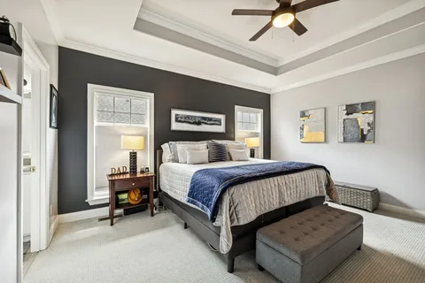 a kitchen with white cabinets stainless steel appliances and sink