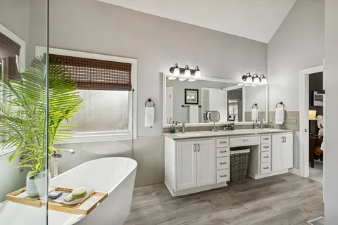 a view of a dining room with furniture a chandelier and wooden floor