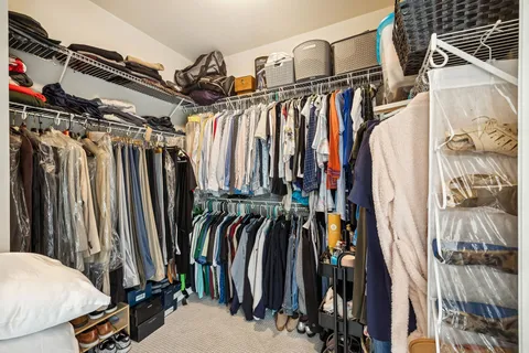 a living room with fireplace furniture and a floor to ceiling window