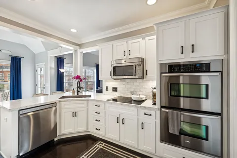 a bathroom with a sink toilet and mirror