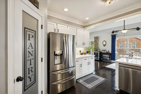 a view of a hallway view with wooden floor and staircase