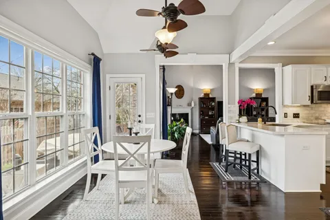 a view of a dining room with furniture and a table