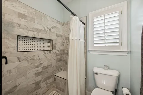 an aerial view of a house with a garden