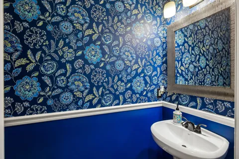 an aerial view of a house with a yard and lake view