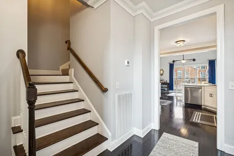 an aerial view of a house with a yard and pool