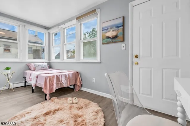 a bed room with a bed and a window