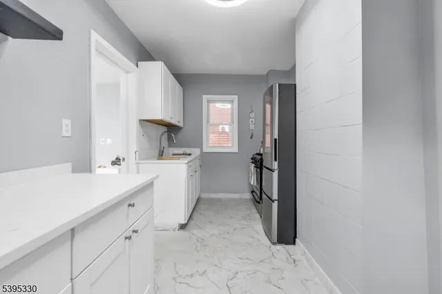 a room with a sink and a mirror