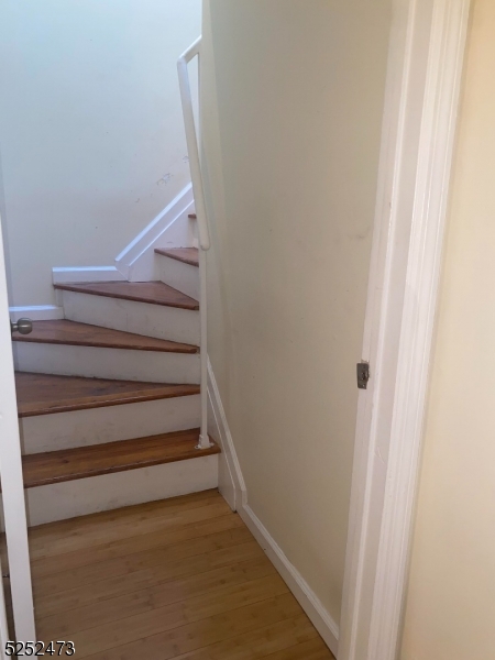 14 Jaques Street, Unit 24 Elizabeth, NJ 07201 - Photo 4 of 17 a view of staircase with white walls and white door
