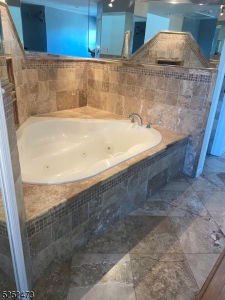 14 Jaques Street, Unit 24 Elizabeth, NJ 07201 - Photo 6 of 17 a bathroom with a bathtub