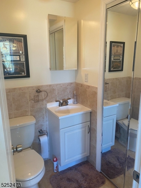 14 Jaques Street, Unit 24 Elizabeth, NJ 07201 - Photo 8 of 17 a bathroom with a toilet sink and mirror