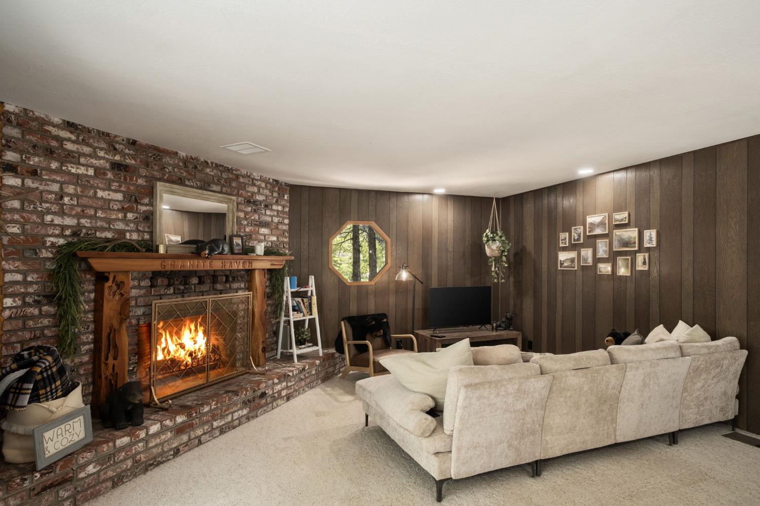42488 Rock Ledge Road Shaver Lake, CA 93664 - Photo 11 of 26 a living room with furniture and a fireplace