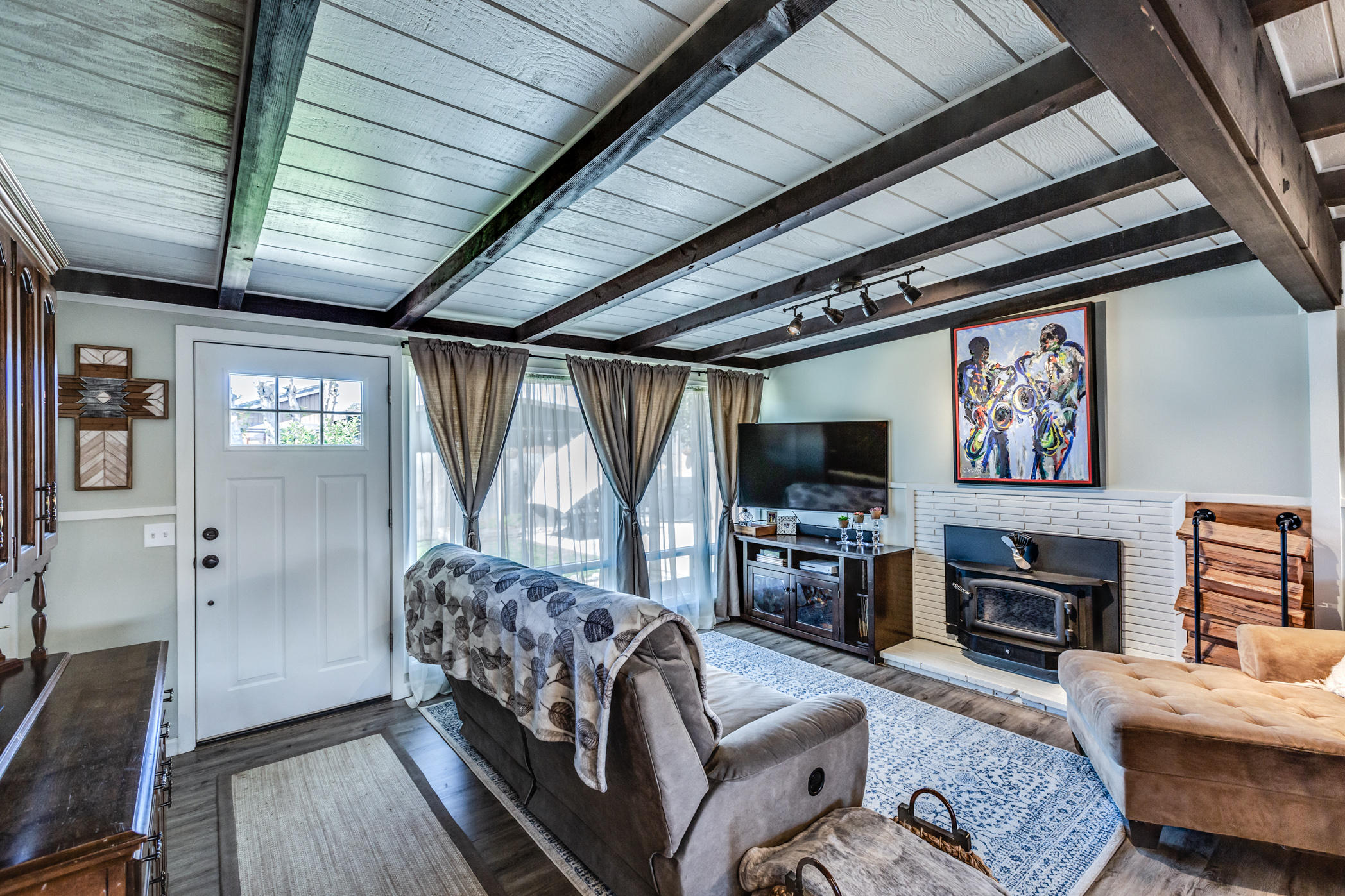 3372 Edgewood Road Myrtletown, CA 95501 - Photo 6 of 44 a living room with furniture a flat screen tv and a fireplace