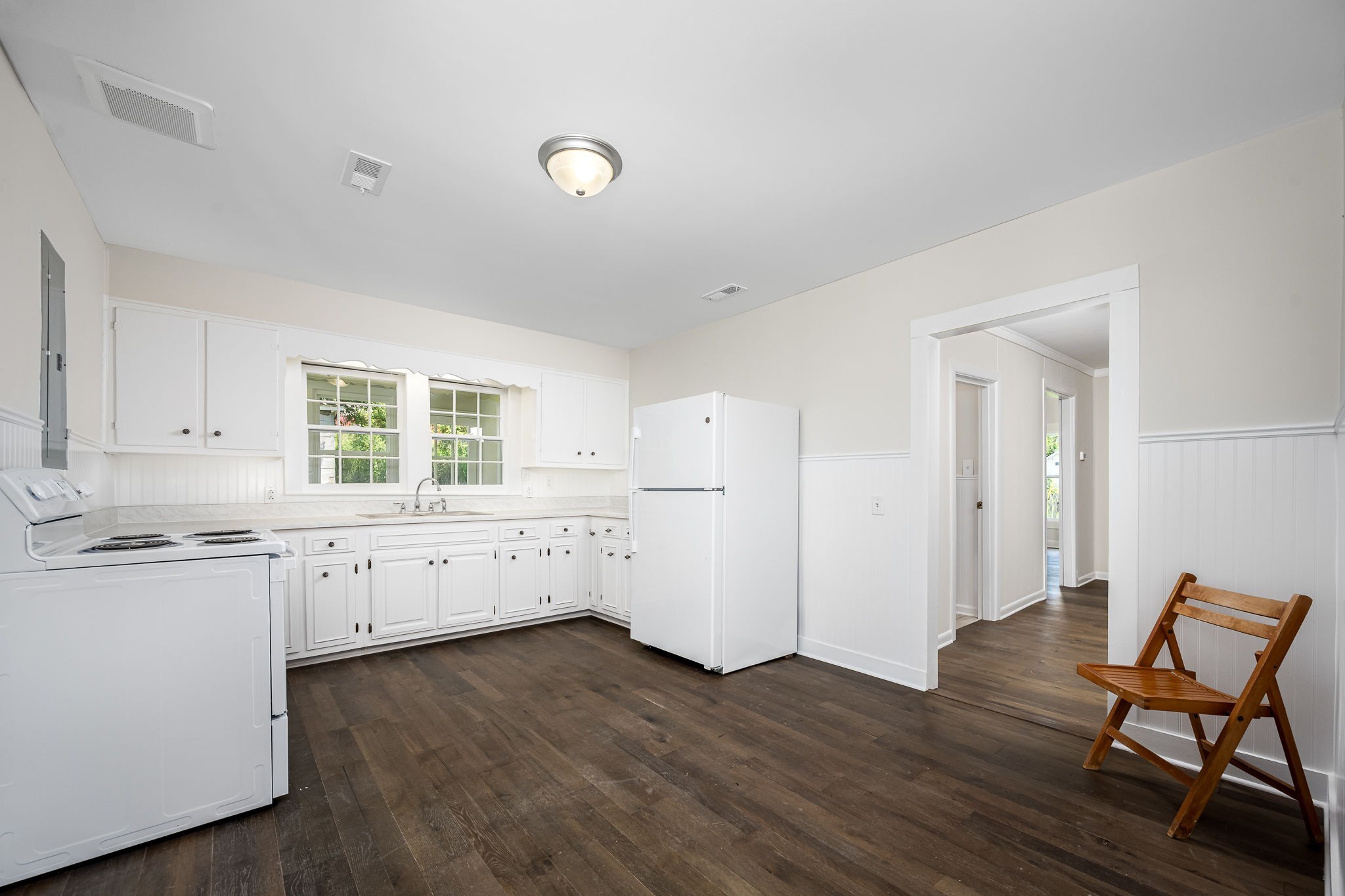 112 R E Davenport Avenue Auburntown, TN 37016 - Photo 16 of 43 a kitchen with granite countertop white cabinets and white appliances