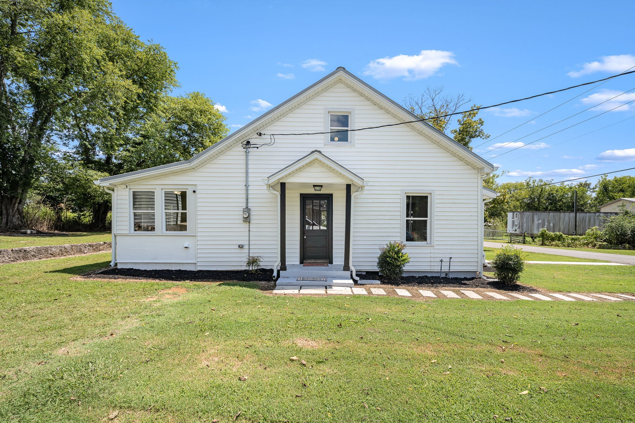 112 R E Davenport Avenue Auburntown, TN 37016 - Photo 37 of 43 a view of a house with a yard and sitting area