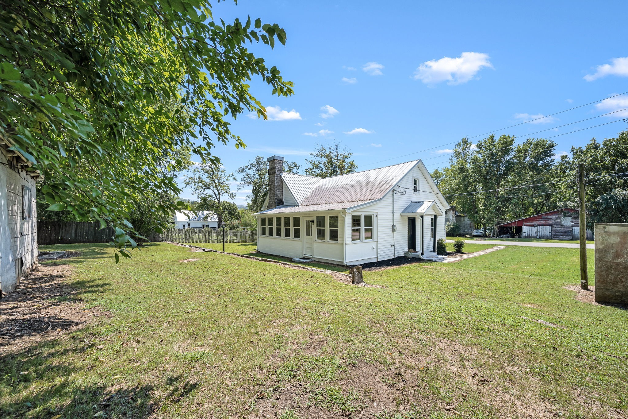 112 R E Davenport Avenue Auburntown, TN 37016 - Photo 39 of 43 a view of a house with a yard and a tree