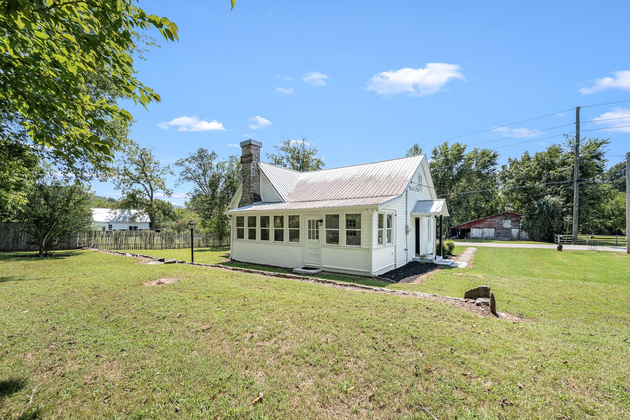 112 R E Davenport Avenue Auburntown, TN 37016 - Photo 4 of 43 a view of a house with a yard and sitting area