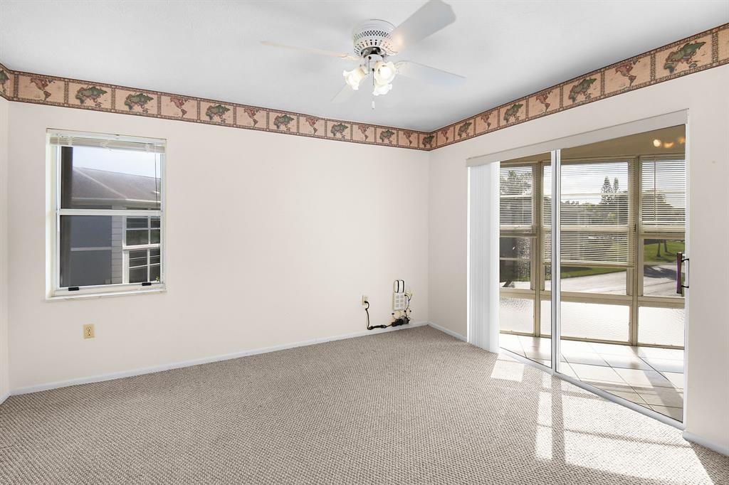 3254 Southeast Aster Lane, Unit J240 Stuart, FL 34994 - Photo 16 of 39 a view of an empty room with a window