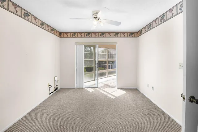 a view of a room with windows and balcony view