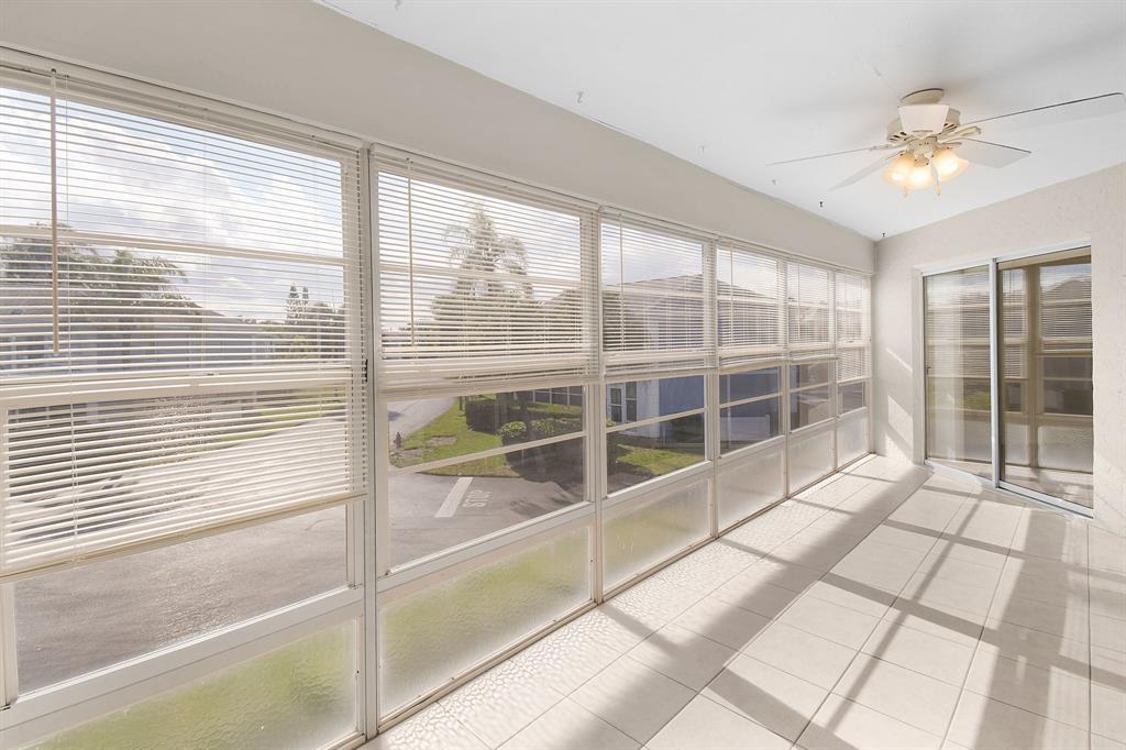 3254 Southeast Aster Lane, Unit J240 Stuart, FL 34994 - Photo 19 of 39 a view of a room with windows and balcony view