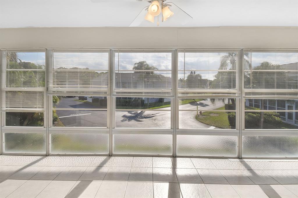 3254 Southeast Aster Lane, Unit J240 Stuart, FL 34994 - Photo 2 of 39 a view of a glass door with a glass door