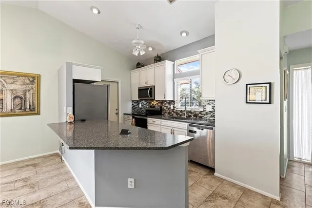 a kitchen with a stove and a microwave