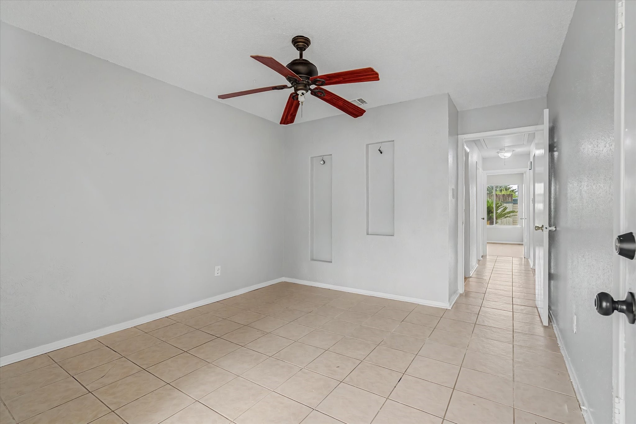 7330 South Dairy Ashford Road Houston, TX 77072 - Photo 19 of 33 a view of a livingroom with a ceiling fan and window
