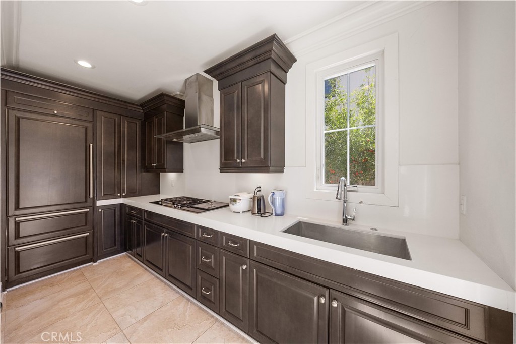 92 Interstellar Irvine, CA 92618 - Photo 23 of 64 a kitchen with a sink stainless steel appliances and cabinets