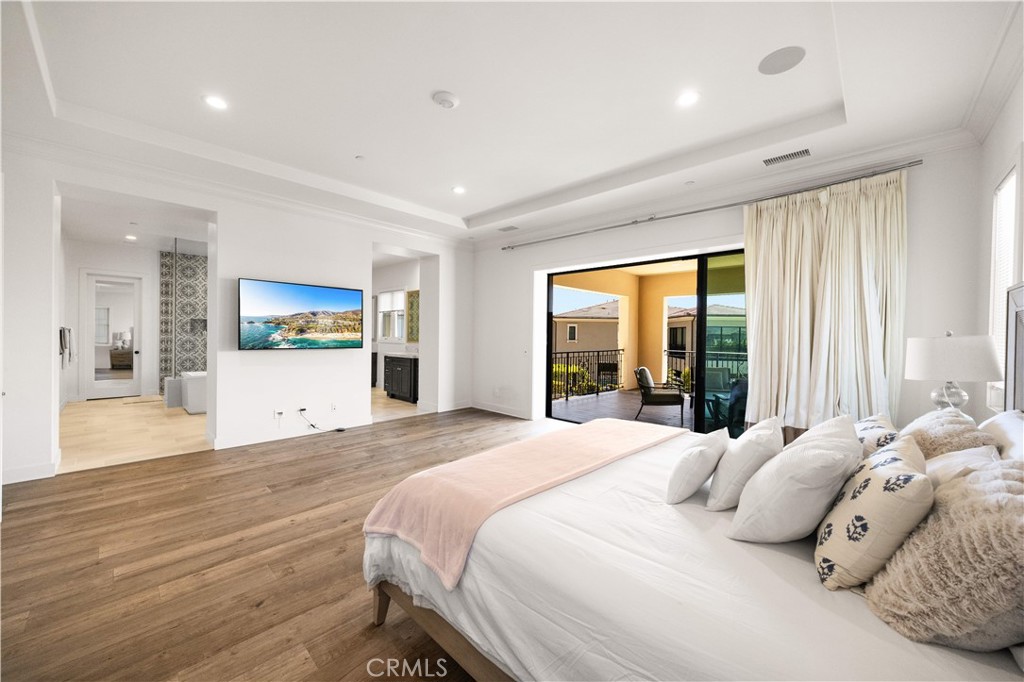 92 Interstellar Irvine, CA 92618 - Photo 25 of 64 a bedroom with a large bed and a large window