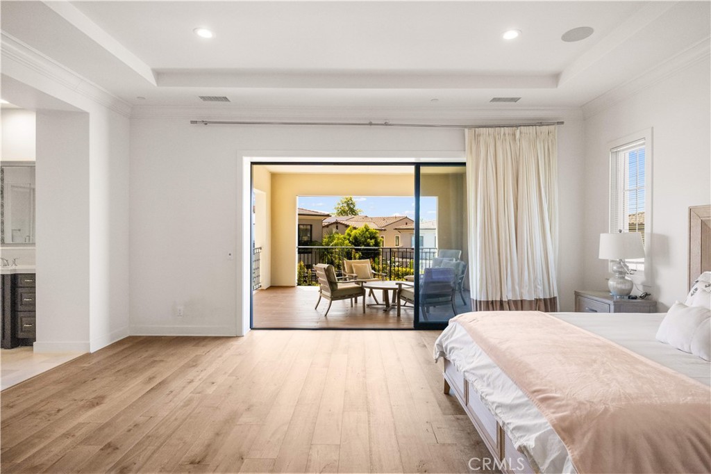 92 Interstellar Irvine, CA 92618 - Photo 26 of 64 a spacious bedroom with a large bed and a large window