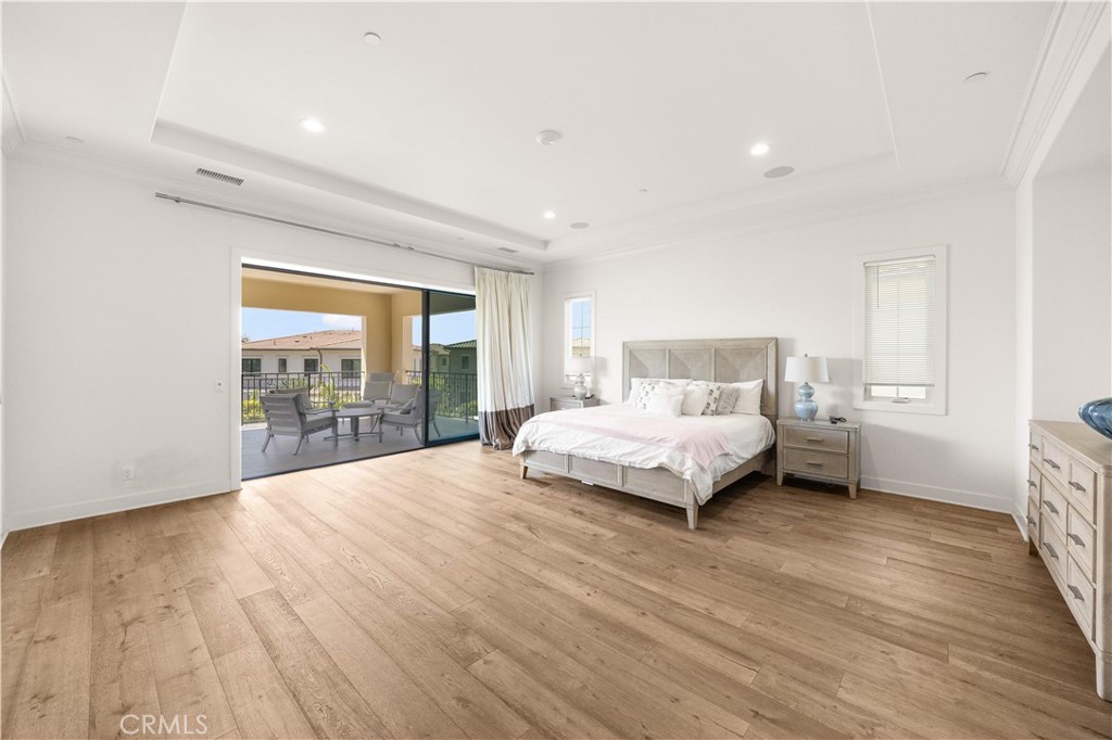 92 Interstellar Irvine, CA 92618 - Photo 27 of 64 a spacious bedroom with a bed and a large window