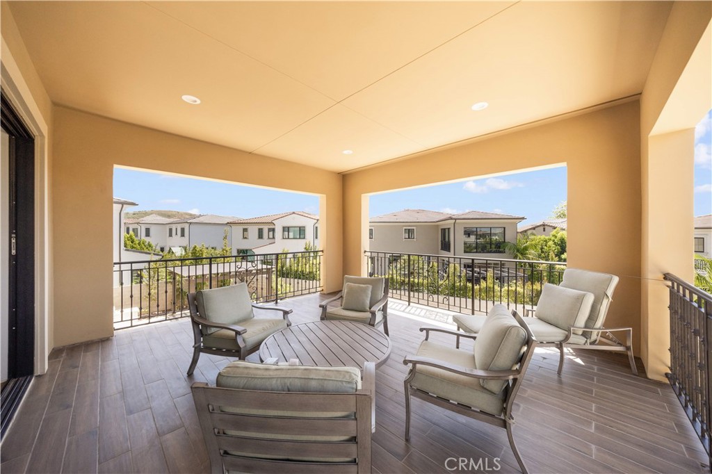92 Interstellar Irvine, CA 92618 - Photo 29 of 64 a living room with furniture and a floor to ceiling window