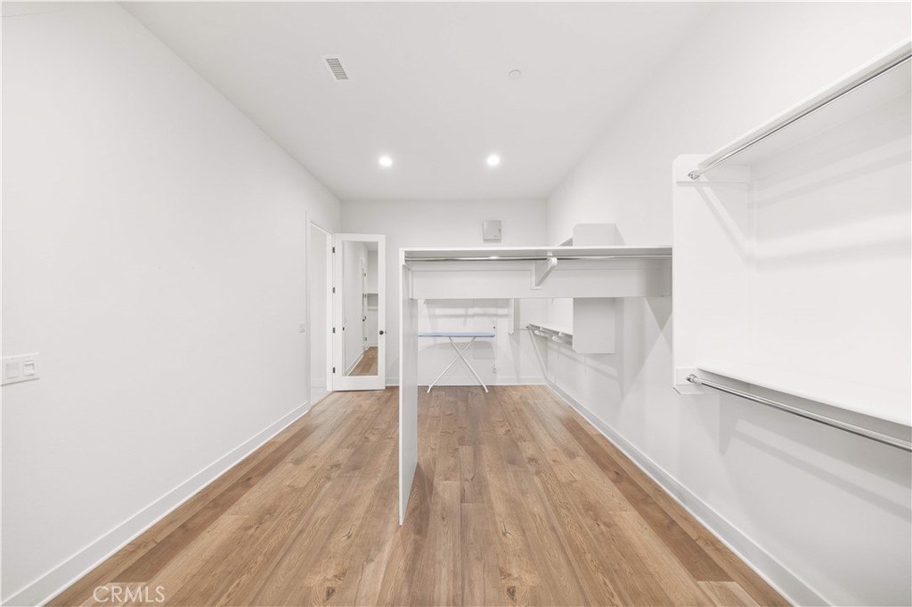 92 Interstellar Irvine, CA 92618 - Photo 34 of 64 a view of a kitchen with wooden floor