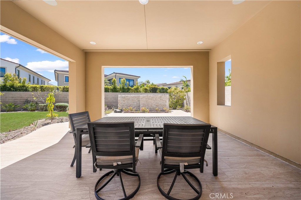 92 Interstellar Irvine, CA 92618 - Photo 37 of 64 a view of a dining room with furniture window and wooden floor