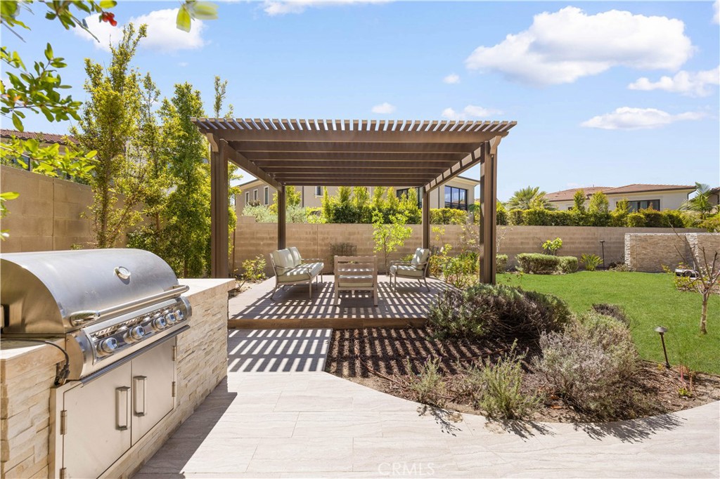 92 Interstellar Irvine, CA 92618 - Photo 41 of 64 a view of a patio with a yard