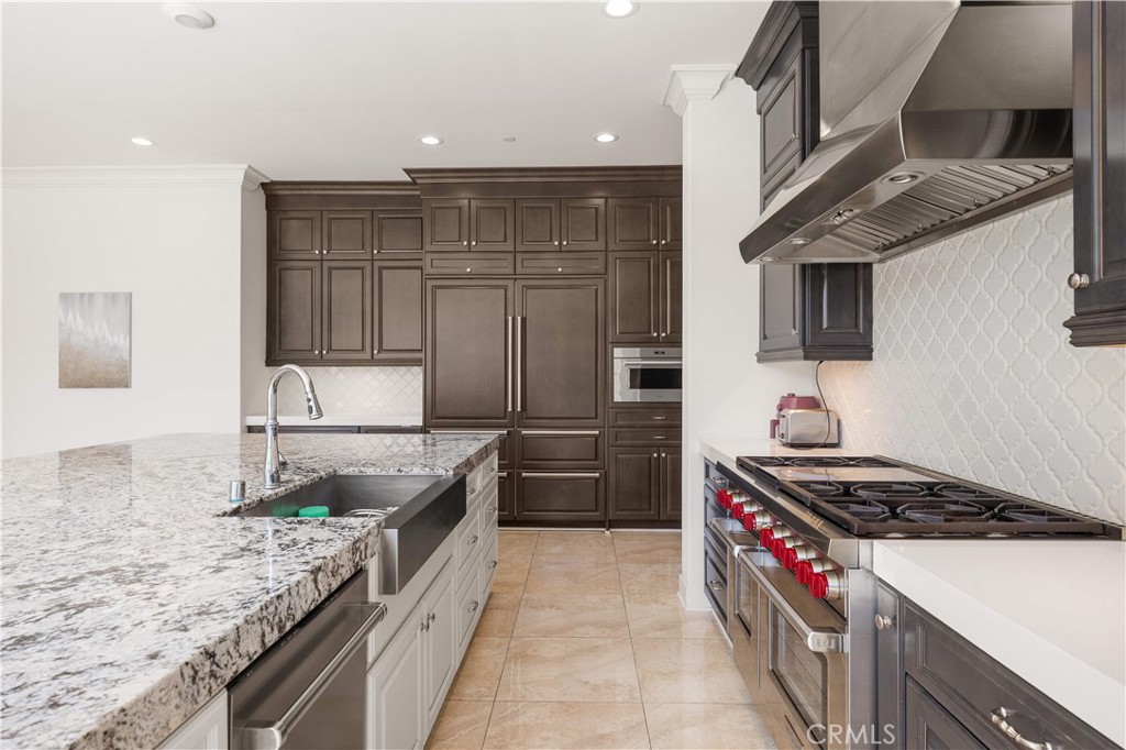 92 Interstellar Irvine, CA 92618 - Photo 8 of 64 a kitchen with granite countertop a sink and stainless steel appliances