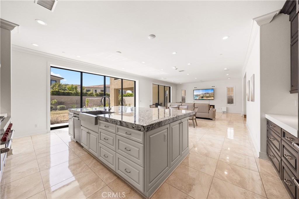 92 Interstellar Irvine, CA 92618 - Photo 9 of 64 a living room with furniture a large window and kitchen view