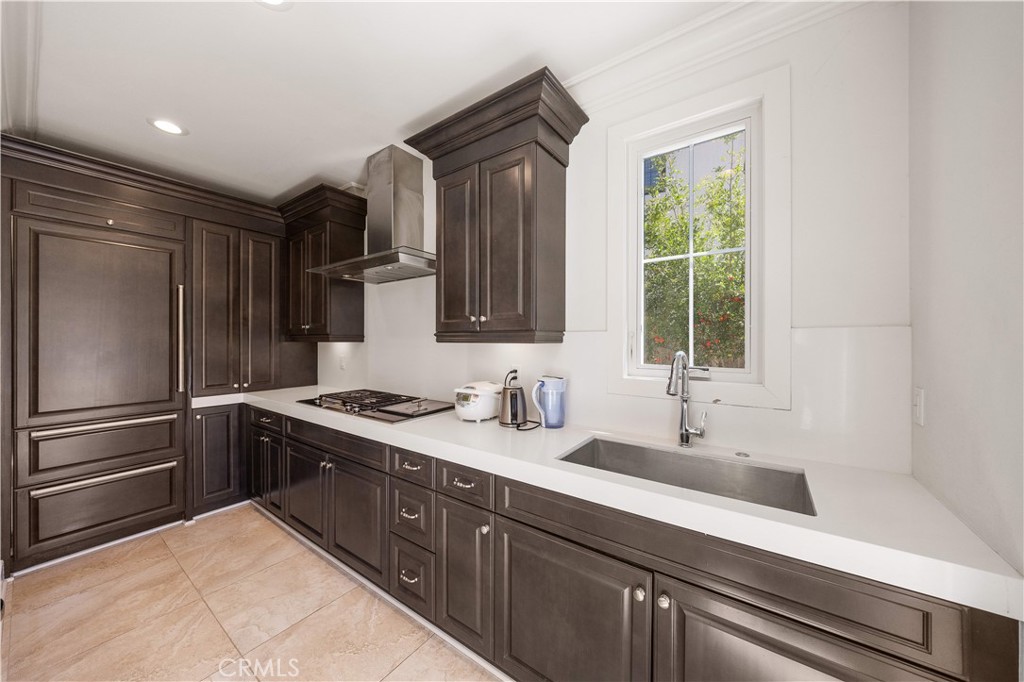 92 Interstellar Irvine, CA 92618 - Photo 10 of 64 a kitchen with a sink stainless steel appliances and cabinets