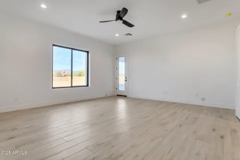 an empty room with a empty space and windows