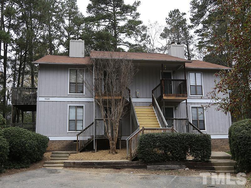 5812 Pointer Drive, Unit 202 Raleigh, NC 27609 - Photo 1 of 19 a front view of a house with garage