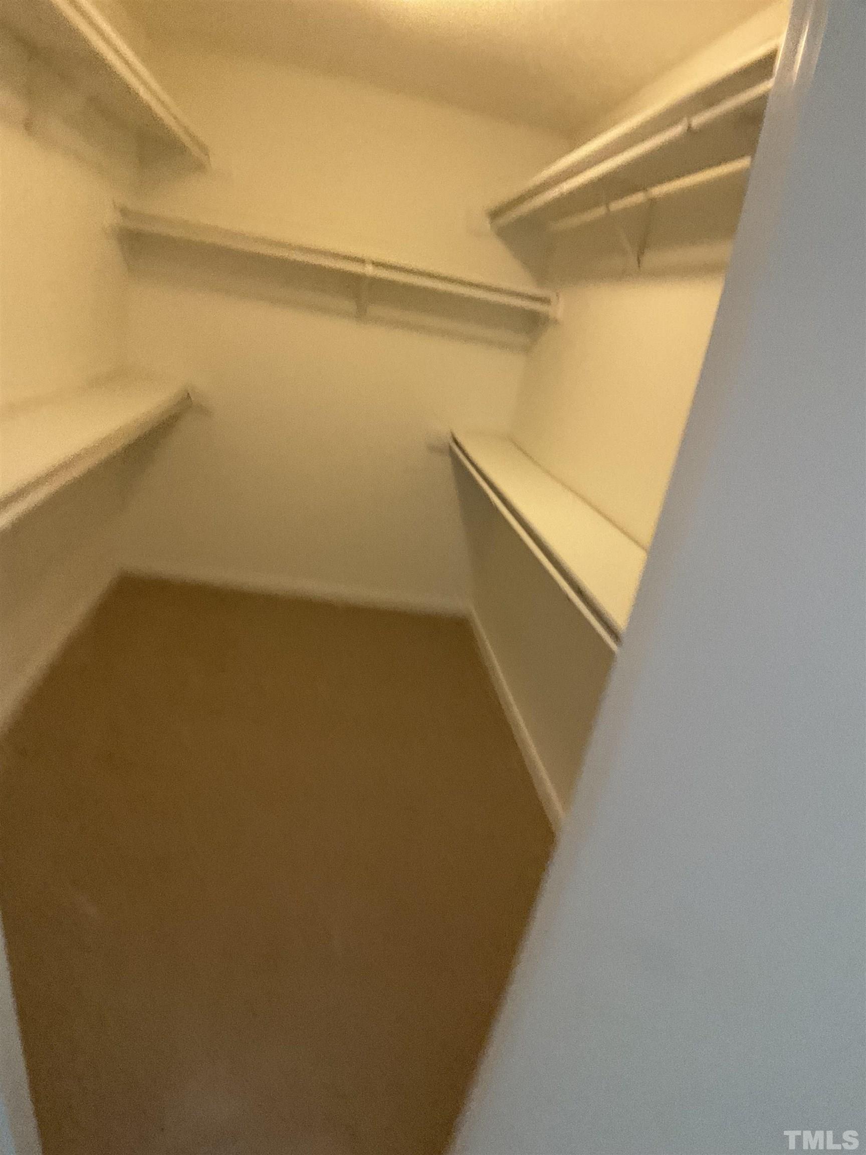 5812 Pointer Drive, Unit 202 Raleigh, NC 27609 - Photo 15 of 19 a view of closet with wooden floor