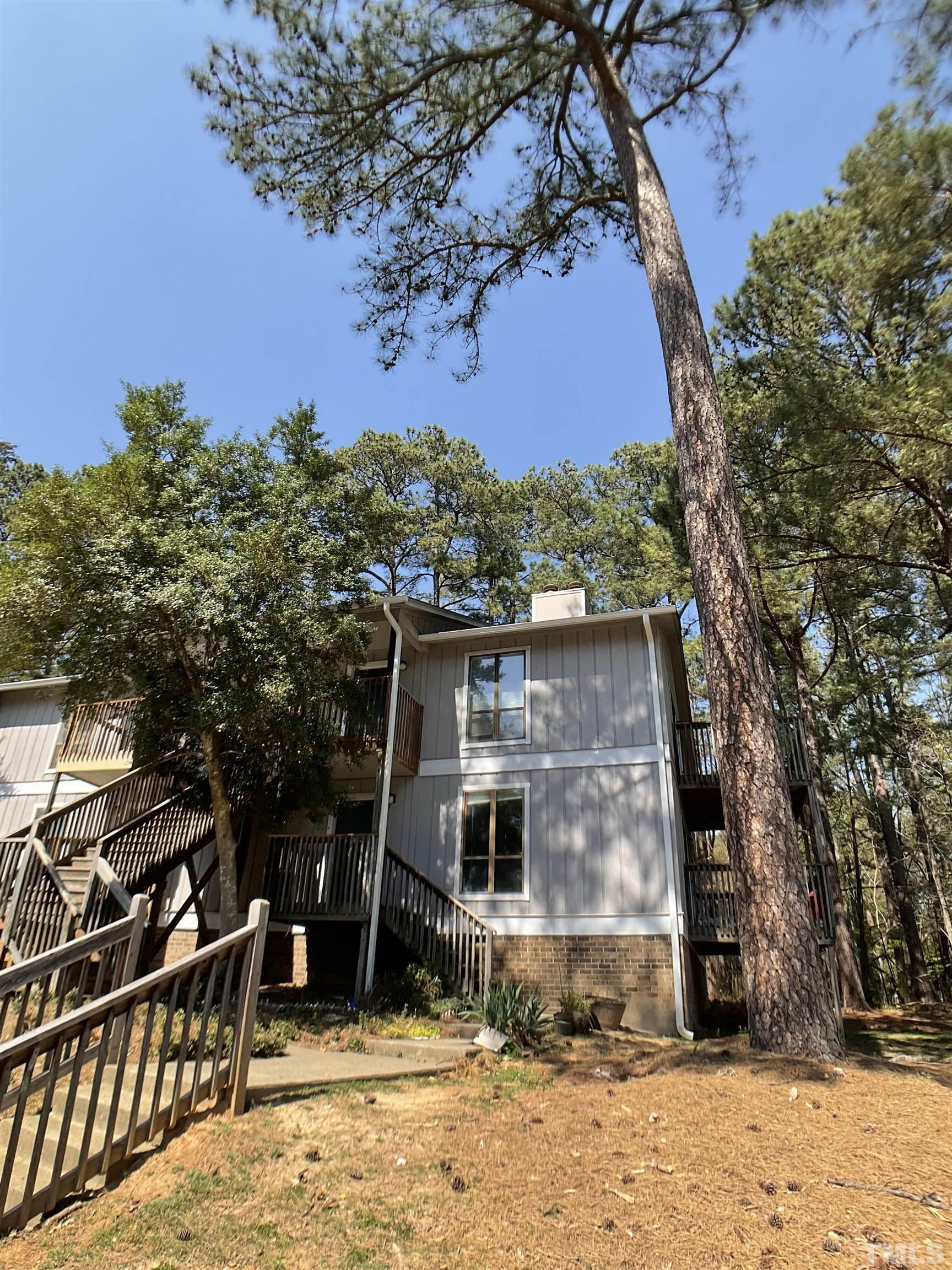 5812 Pointer Drive, Unit 202 Raleigh, NC 27609 - Photo 19 of 19 a view of a house with a yard