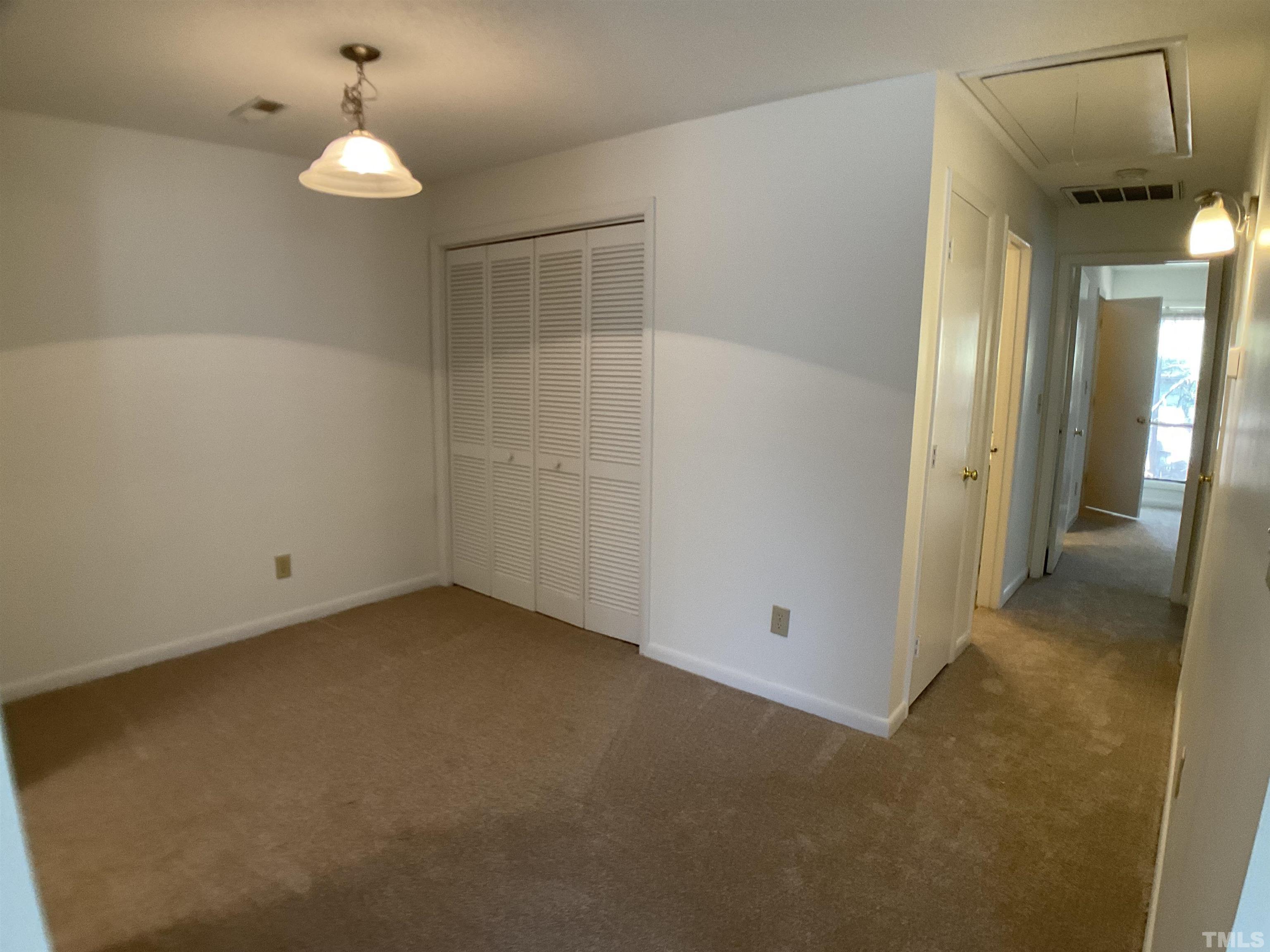 5812 Pointer Drive, Unit 202 Raleigh, NC 27609 - Photo 7 of 19 an empty room with a bathroom