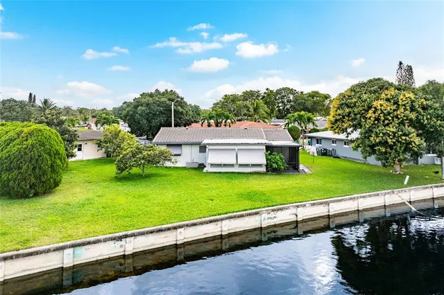 an aerial view of a house with a lake view