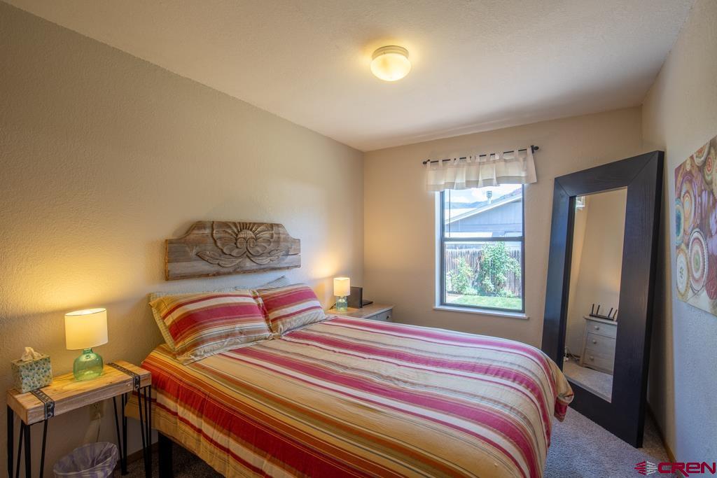 128 Hermosa Circle Durango, CO 81301 - Photo 14 of 26 a bedroom with a bed and window