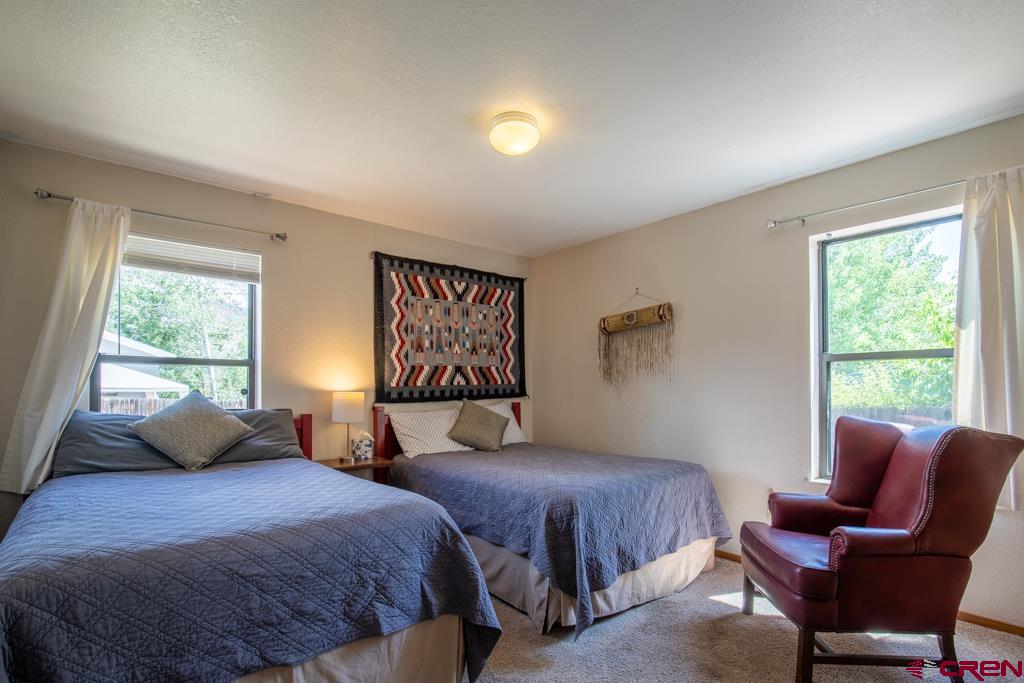 128 Hermosa Circle Durango, CO 81301 - Photo 15 of 26 a bedroom with two beds and a window